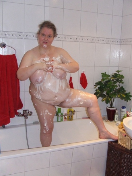 german bbw samantha teasing in black stockings on the bed nudes photos